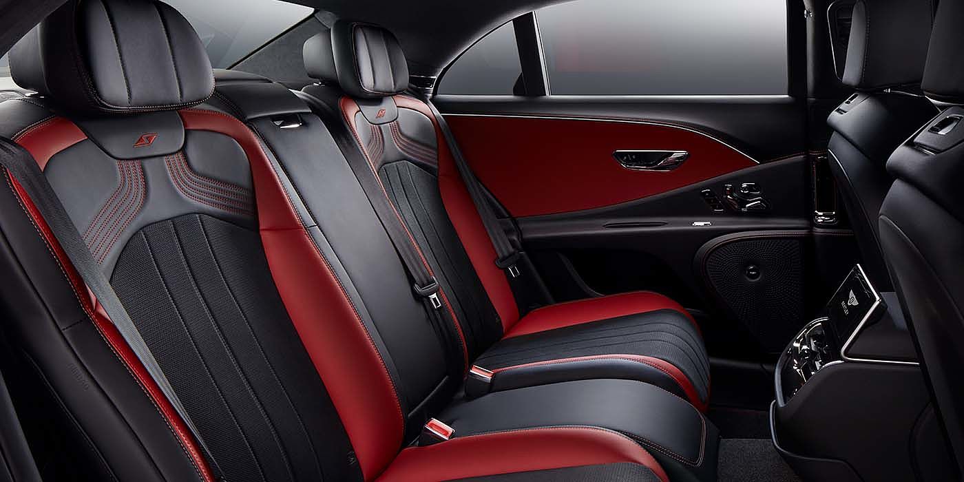 Bentley Taichung Bentley Flying Spur S sedan rear interior in Beluga black and Hotspur red hide with S stitching