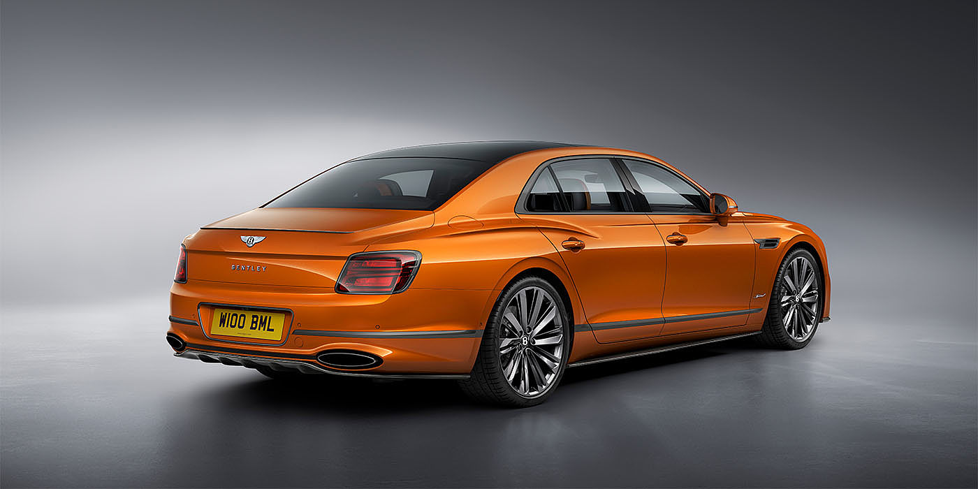 Bentley Taichung Bentley Flying Spur Speed in Orange Flame colour rear view, featuring Bentley insignia and enhanced exhaust muffler.