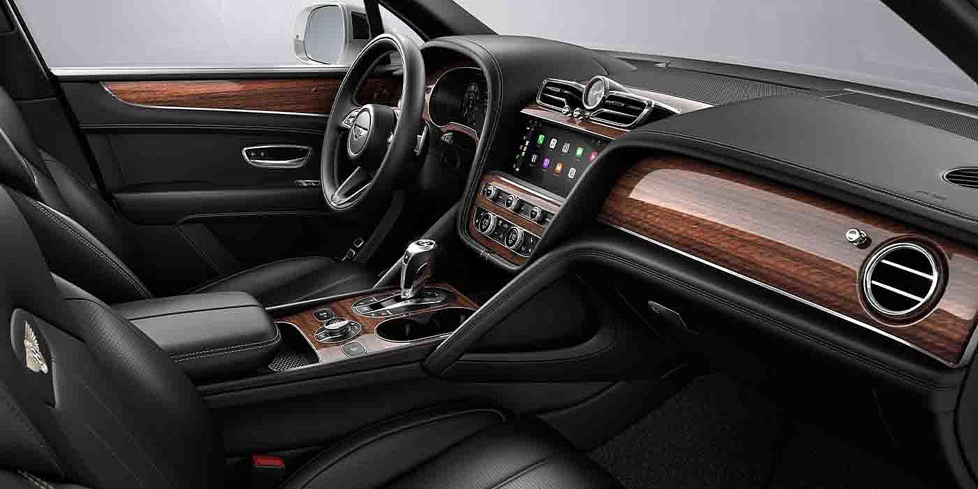 Bentley Taichung Bentley Bentayga EWB interior with a Crown Cut Walnut veneer, view from the passenger seat over looking the driver's seat.