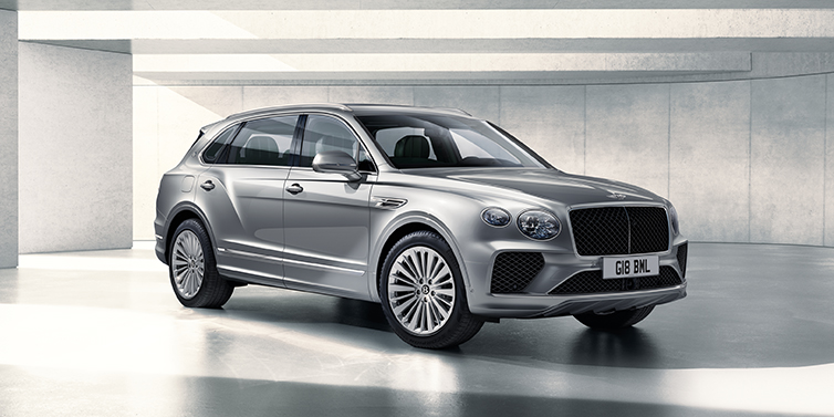 Bentley Taichung Bentley Bentayga Extended Wheelbase SUV front three quarter in Moonbeam paint with a grey background