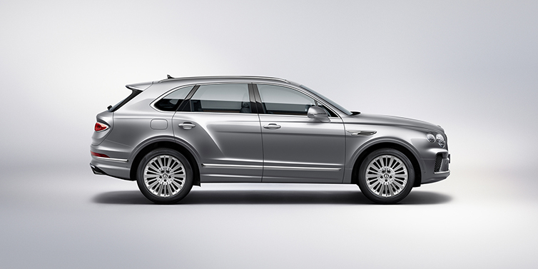 Bentley Taichung Bentley Bentayga SUV side profile in Moonbeam silver paint against white background featuring 21 inch 5 spoke wheels